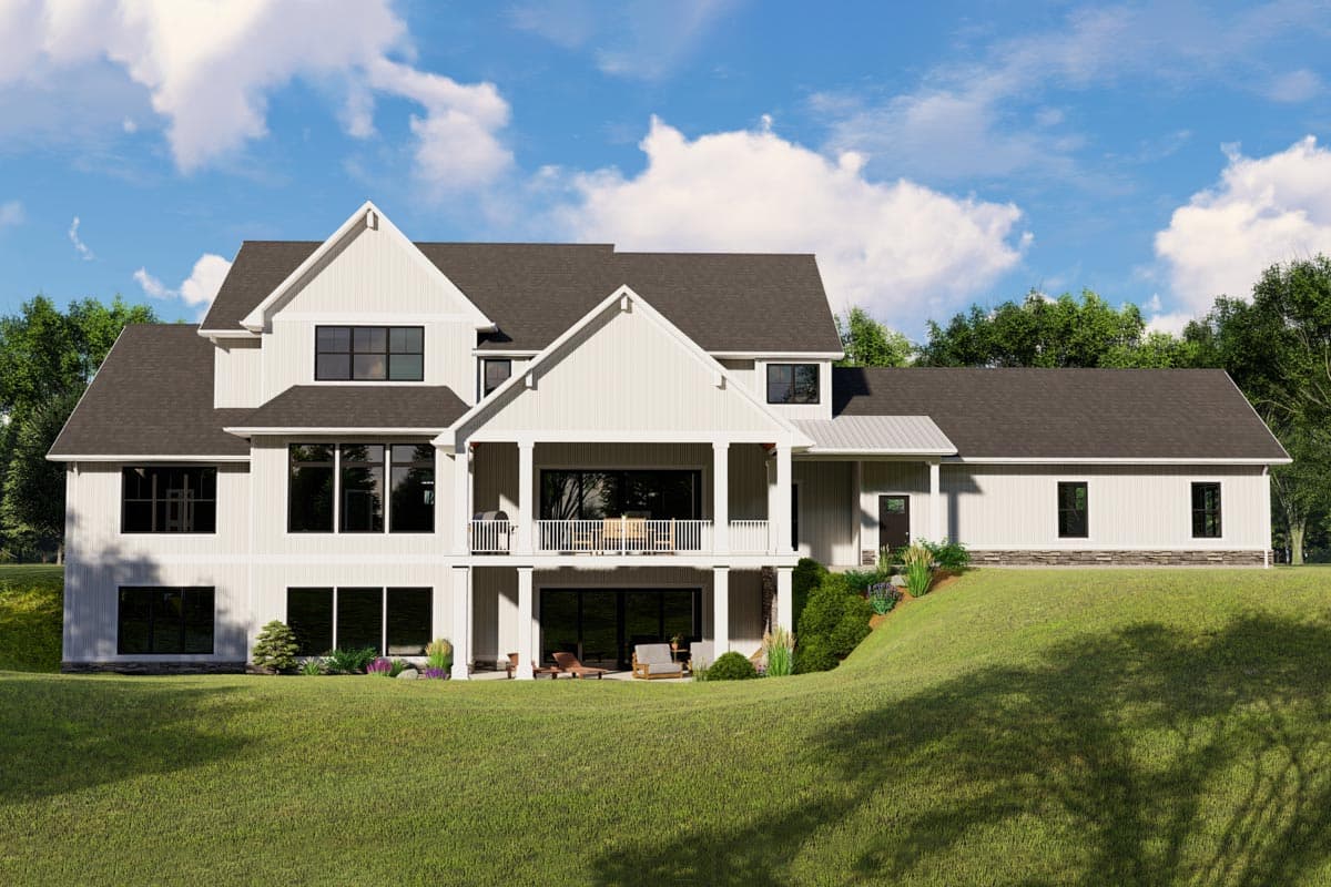 House plan exterior: Modern Farmhouse style, multiple gables, covered balconies, and large windows on a sloped lot.