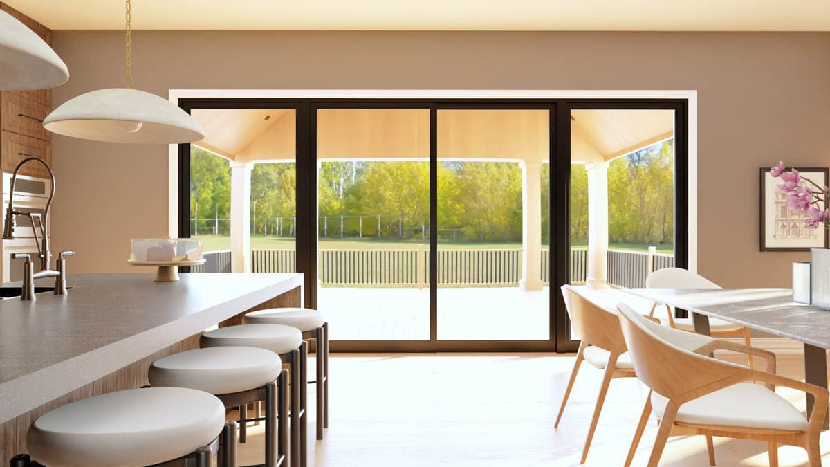 Interior rendering of a kitchen with island and dining area, showing large sliding glass doors to a covered porch and backyard.