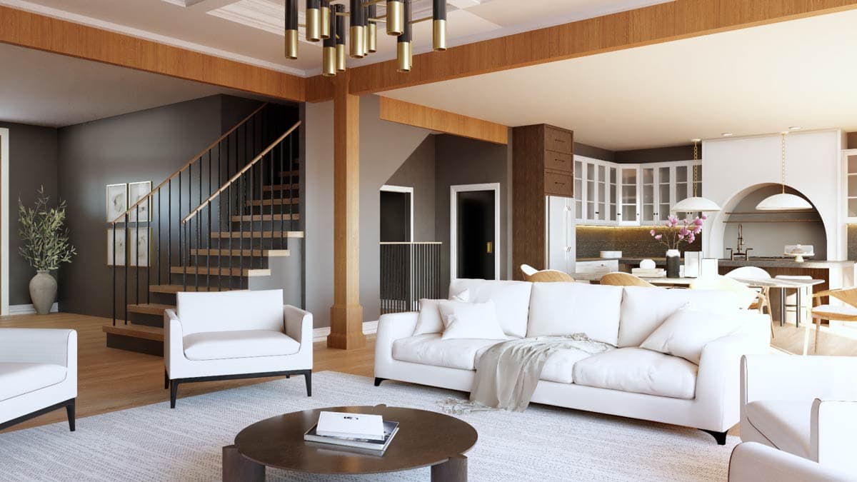Interior view of a living area with open layout, floating stairs with metal railing, and a kitchen with arched pass-through.