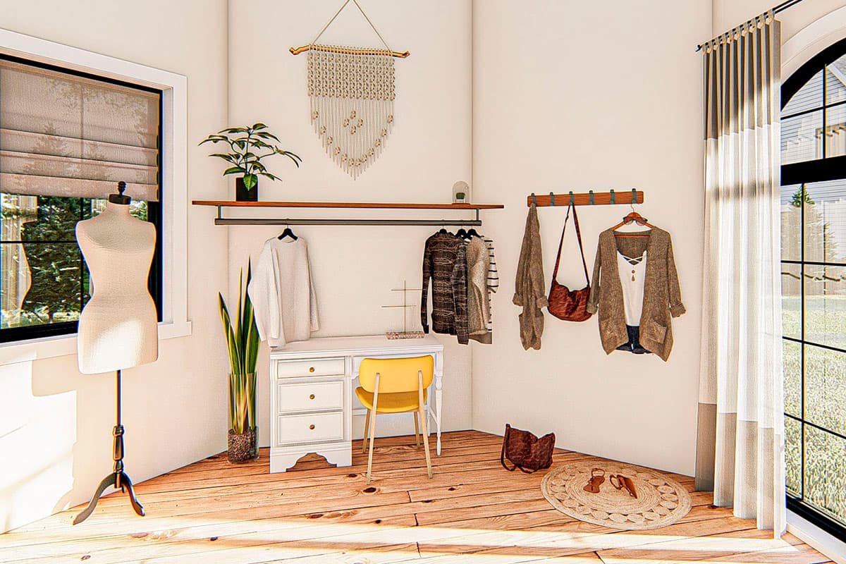 Interior rendering of a dressing room with clothing racks, a desk with a yellow chair, and a mannequin.