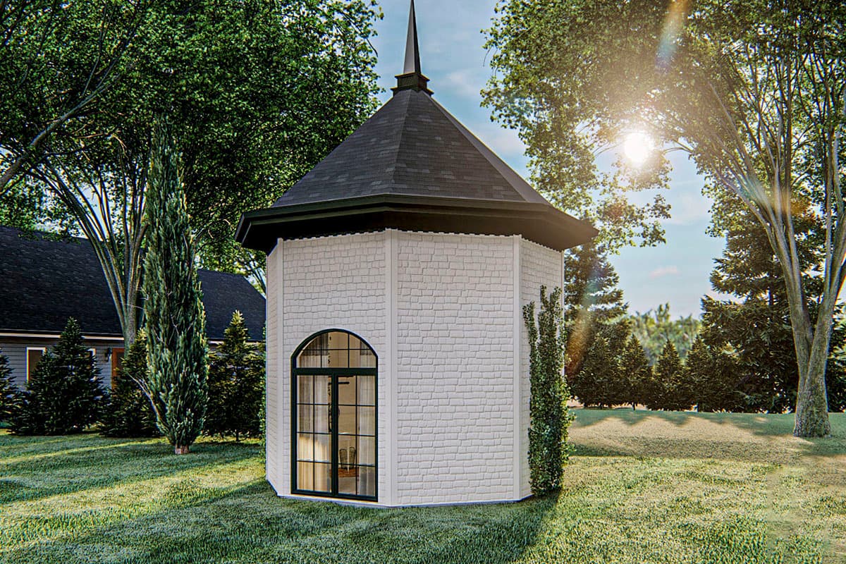 Exterior view of an octagonal pavilion with a steeple, arched window, and white shingle siding.