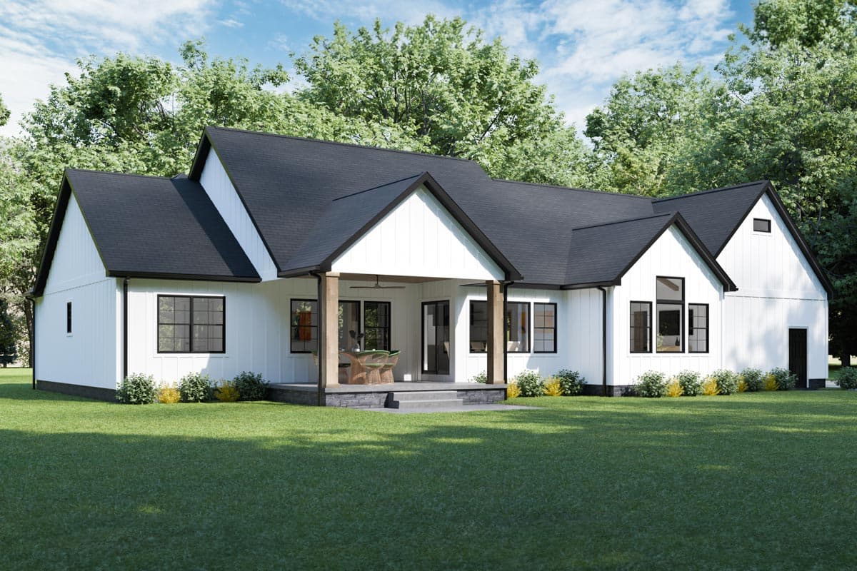 Modern Farmhouse style house plan exterior with white board and batten siding, black gabled rooflines, and covered porch.