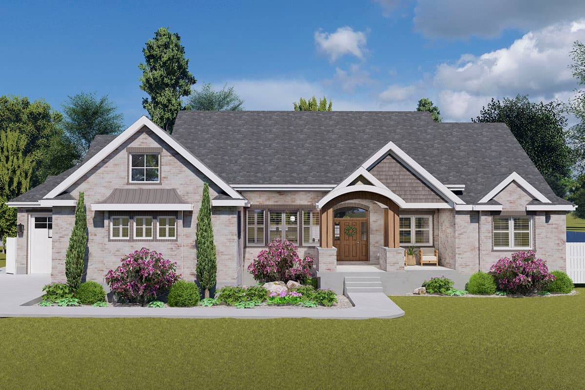 House plan exterior with brick facade, front entry porch, gabled roof, and multiple dormers. A detached garage is visible on the left.