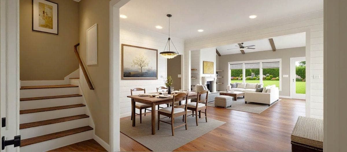 Spacious, modern living space with hardwood floors, a dining area, and a living room with an outdoor view. Features include a staircase and artwork.