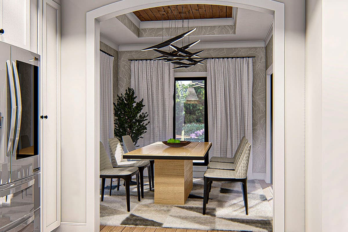 Dining room with wood-paneled tray ceiling, modern chandelier, large window, and wooden pedestal table with chairs.