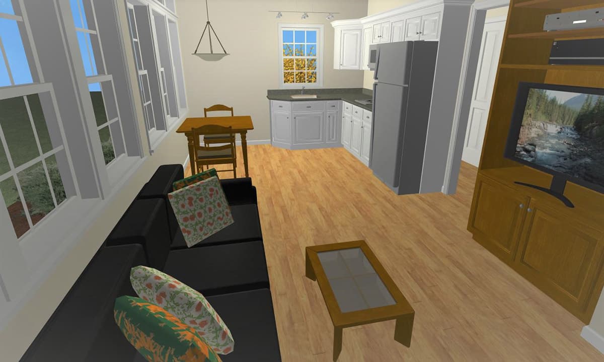 Open concept living area with black sofa, coffee table, dining area, and L-shaped kitchen with white cabinets and stainless steel appliances.