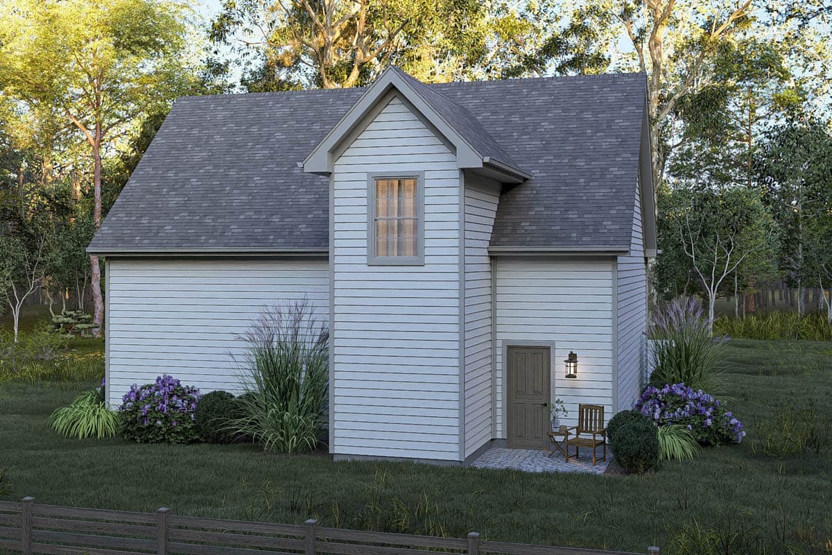 House plan exterior: A two-story home with a prominent gable, horizontal siding, a dormer window, and a side entrance with a small patio.