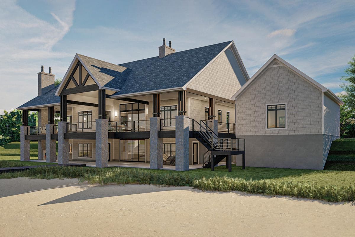 House plan exterior: Modern style, multi-level home with stone pillars, large deck, gables, and prominent rooflines.