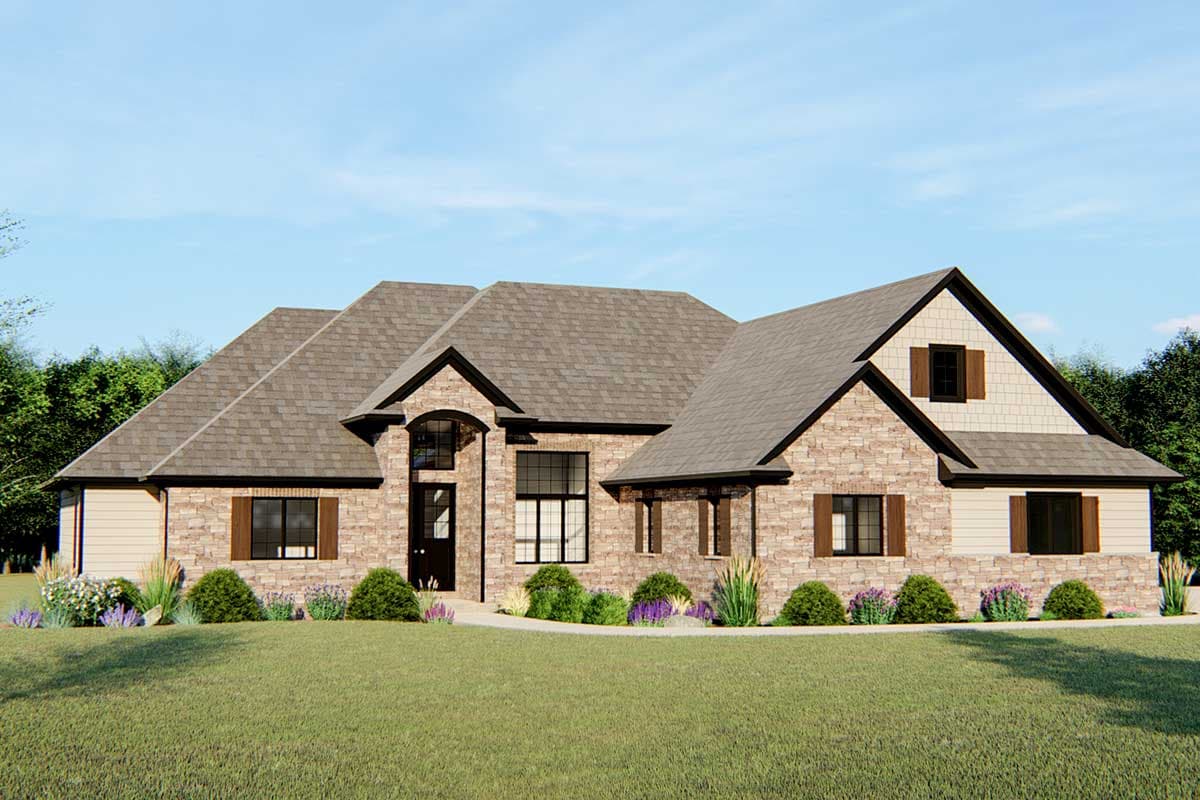 House plan exterior. Two-story, stone facade with multiple gables, arched entry, and wood shutters. Landscaping in foreground.