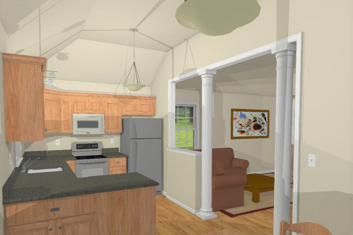 Kitchen with wood cabinets, granite counters, stove, microwave, and refrigerator. Open to a living area with chair and table.