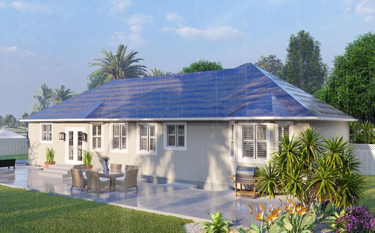 House plan exterior: single-story home with hipped roof, double doors, shutters, and large patio with outdoor furniture and grill.