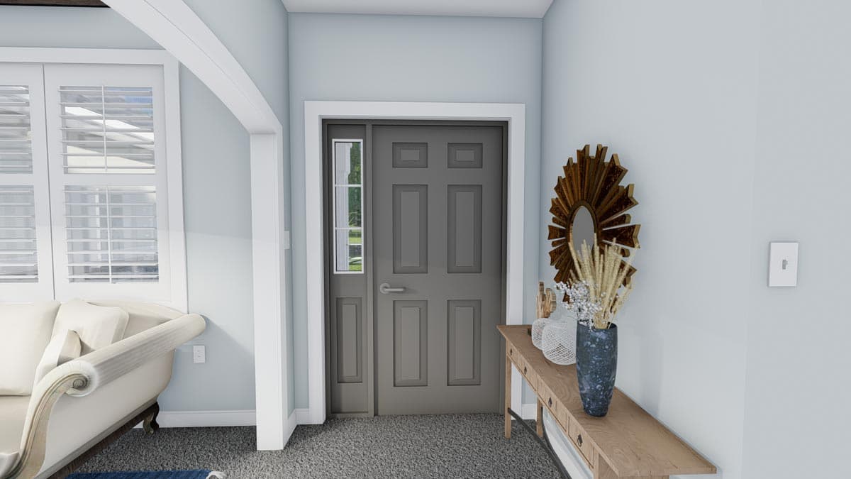 Interior view of a gray paneled front door with a sidelight, adjacent to shuttered windows and a sofa.