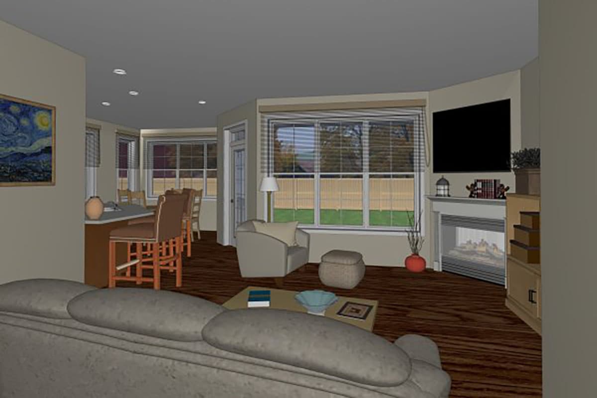 Open concept living area with kitchen island, seating, fireplace, and large windows overlooking backyard.