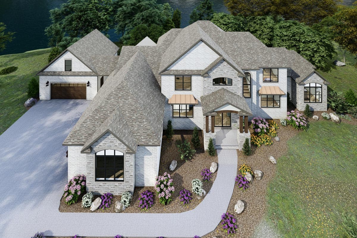 House plan exterior: Two-story home with white brick, multiple gables, A-frame dormer, and attached side-entry garage.