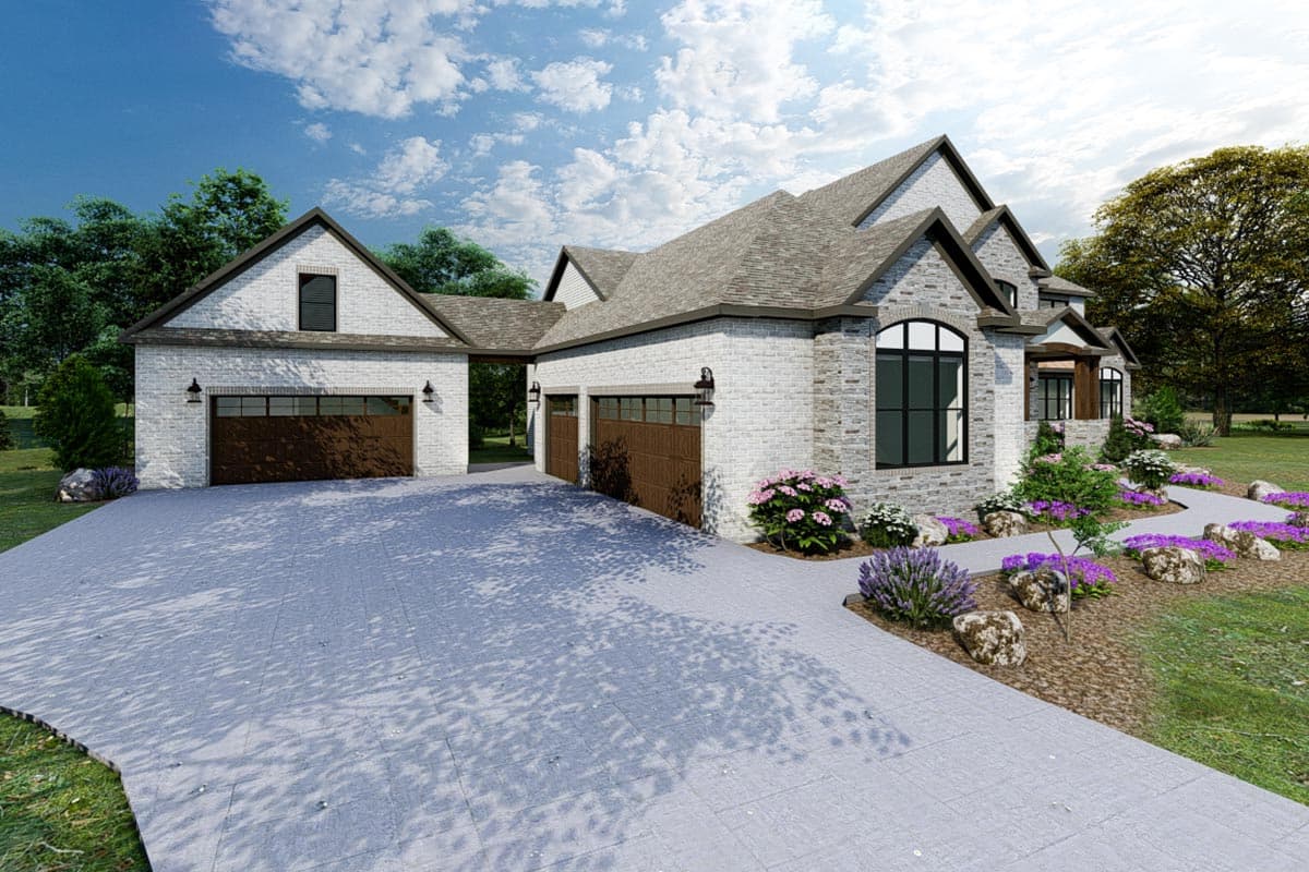 House plan exterior with white brick, stone accents, three-car garage, gables, and arched windows.