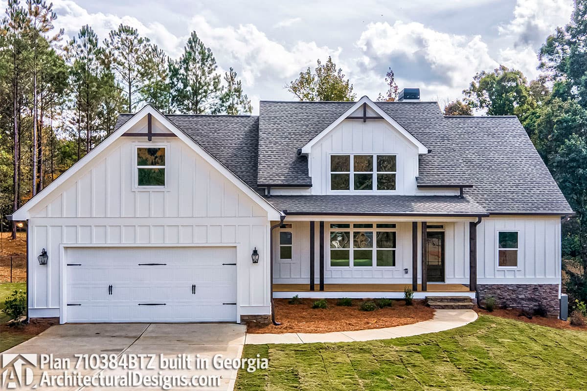House plan exterior: Modern Farmhouse style, two stories, board and batten siding, gable, dormer window, and two-car garage.