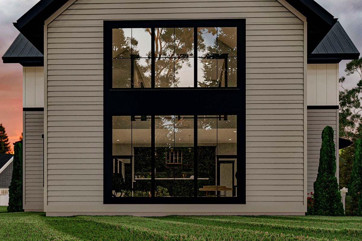 Two-story house plan exterior with horizontal siding, large black-framed windows, and gable rooflines.
