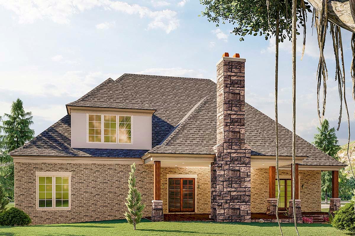 House plan exterior view with brick facade, large stone chimney, and a covered porch with wood columns.