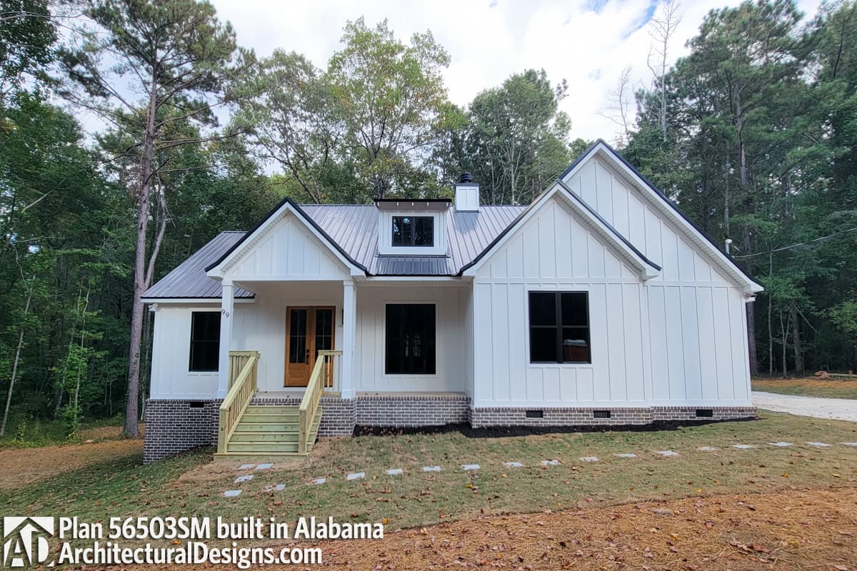 House plan exterior: Modern Farmhouse style, one story, metal roof, gabled dormer, covered porch with stairs.