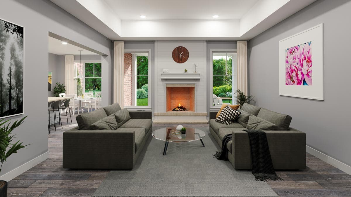 Living room rendering with fireplace, two sofas, coffee table, and view into dining area. Architectural Digest.