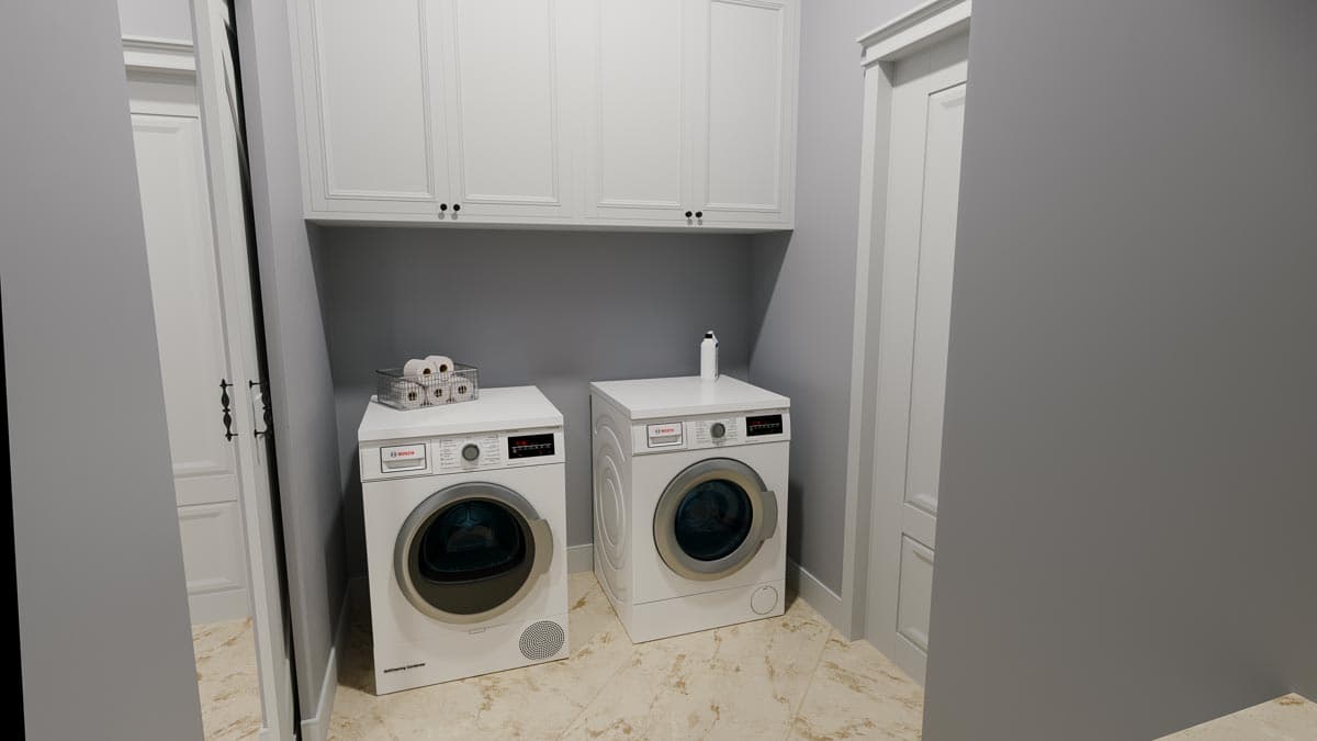 Laundry room with white washer and dryer, overhead cabinets, and a closet with double doors.