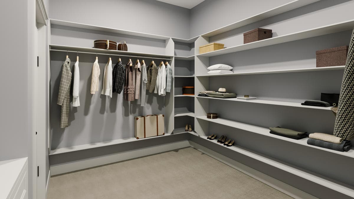 Walk-in closet with extensive shelving, hanging rods, and shoe storage.