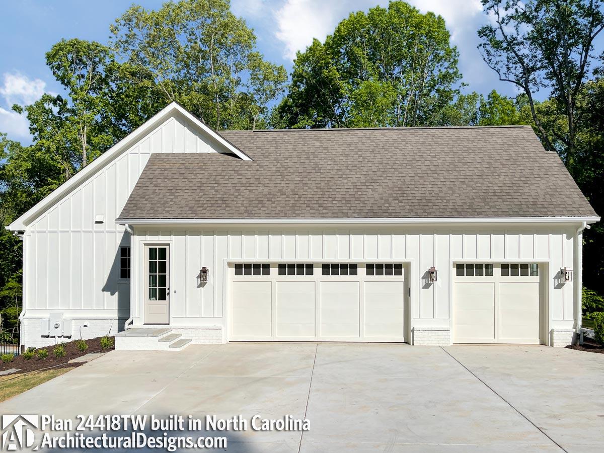 Modern Farmhouse house plan exterior with vertical siding, a prominent gable, three garage bays, and a covered entry.