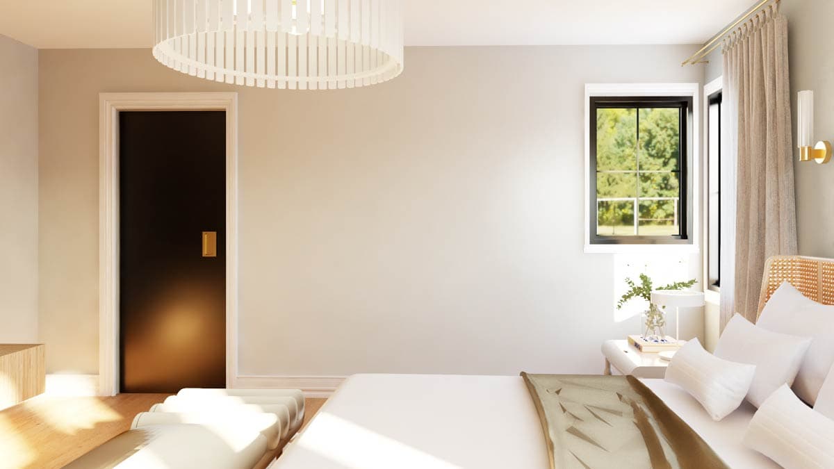 Bedroom interior with a dark door, large window, bed with white pillows, and a decorative pendant light.
