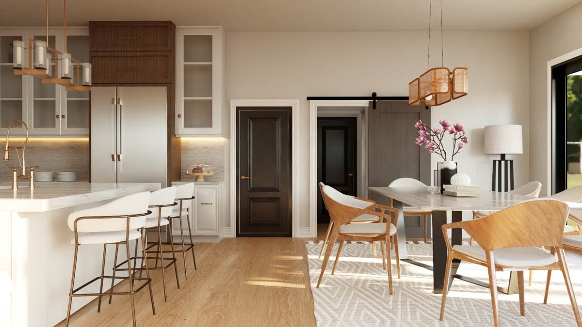 Modern kitchen and dining area with island, bar stools, dining table, chairs, and two doors leading to other rooms.