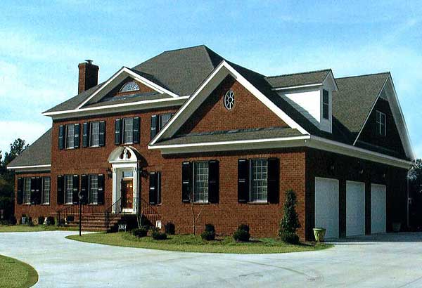 House plan exterior: Brick, two-story residence with arched portico, multiple gables, dormer, and three-car garage.