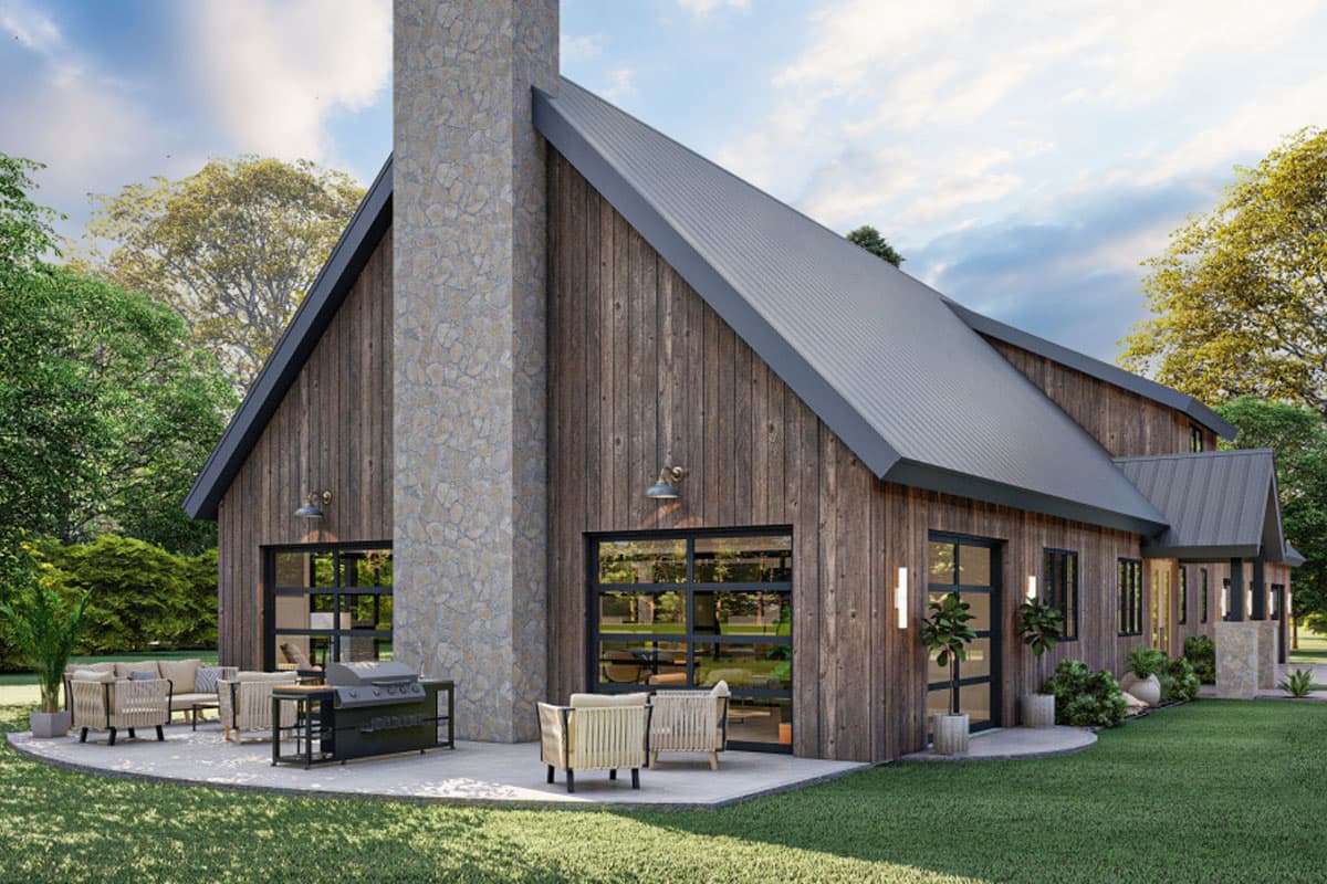 House plan exterior featuring a modern rustic style with wood siding, metal roof, stone chimney, and garage-style glass doors.