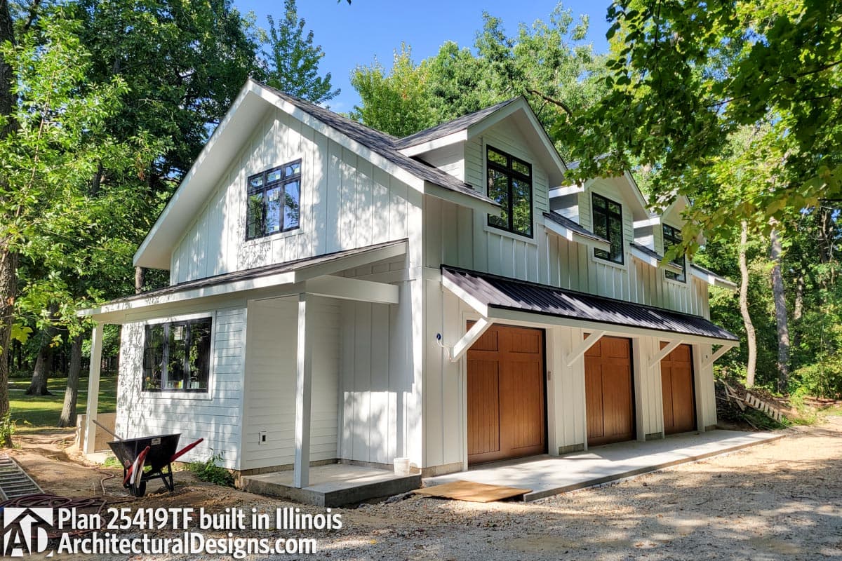 Modern Farmhouse house plan exterior with three-car garage, board and batten siding, gabled dormers, and covered entry.