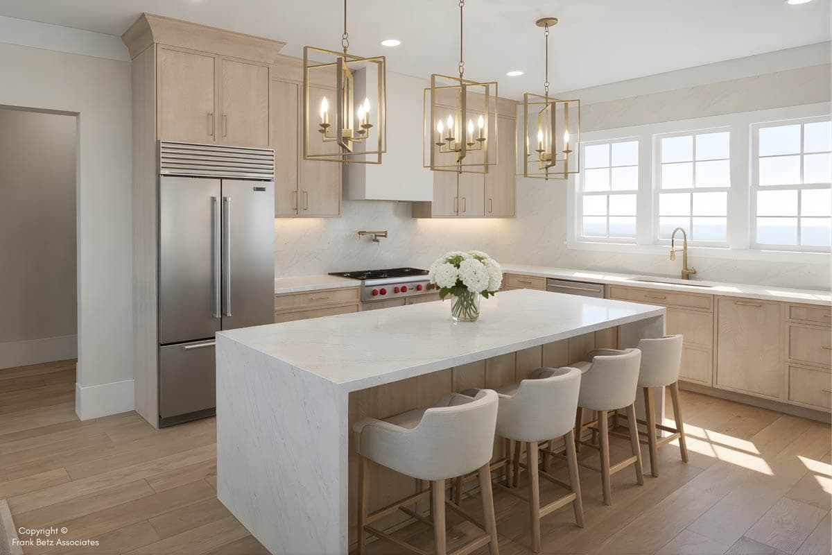 Kitchen with light wood cabinetry, large marble island with seating, stainless steel appliances, and three pendant lights.