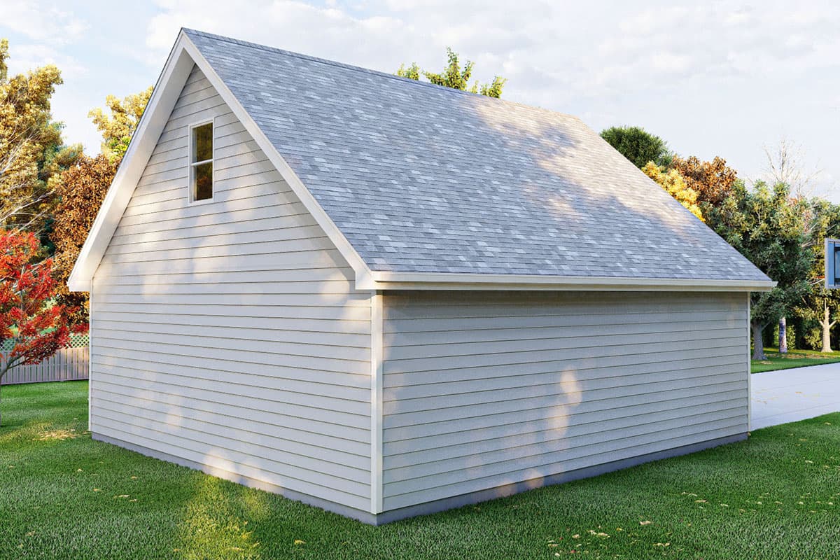 Exterior view of a one-story garage with horizontal siding, a gable end with a single window, and a gray asphalt shingle roof.