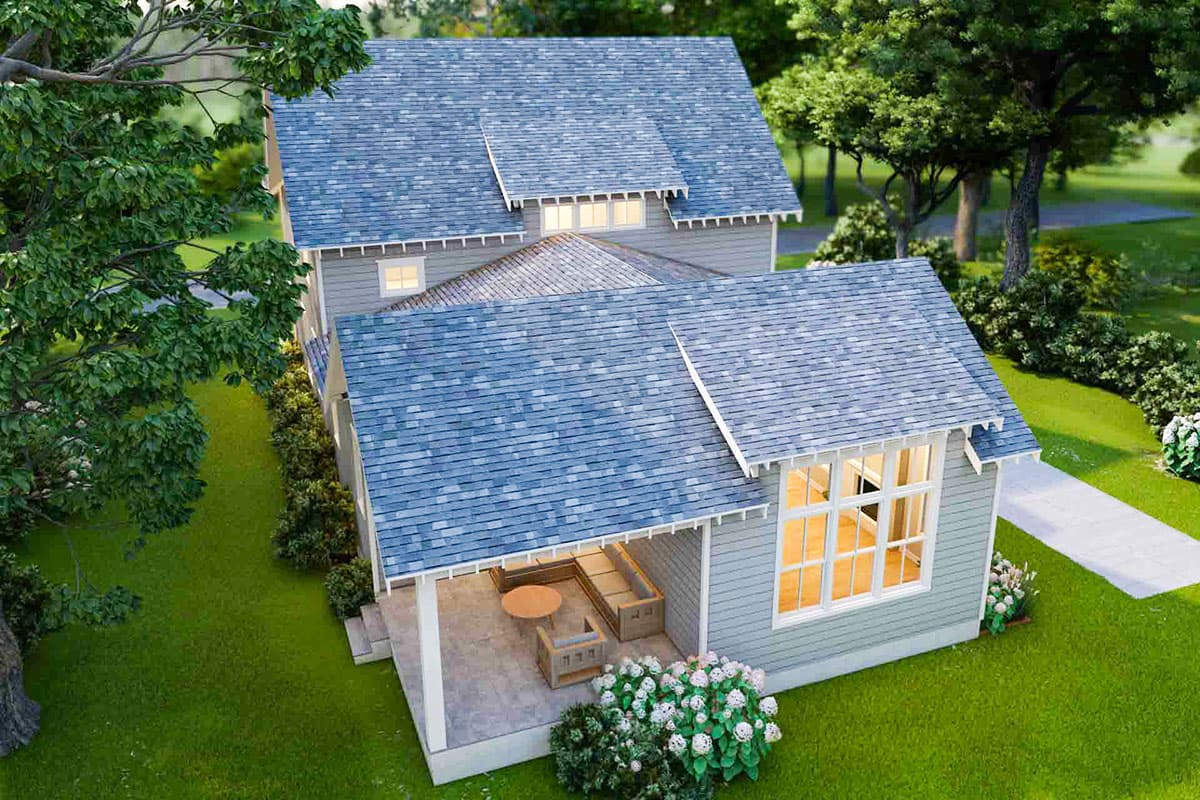 House plan exterior with gabled roofs, dormer windows, and a covered porch with seating.