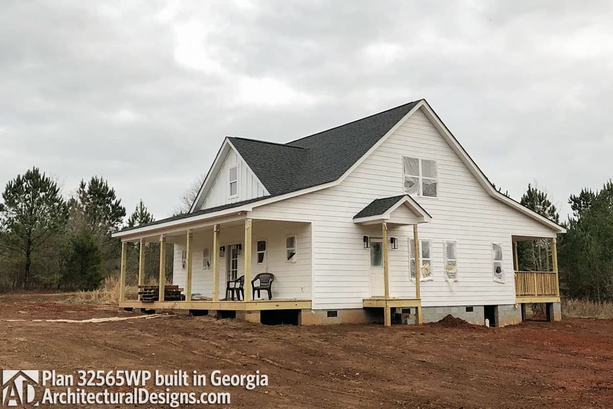 Modern Farmhouse house plan exterior with wraparound porch, gables, and board and batten accents.