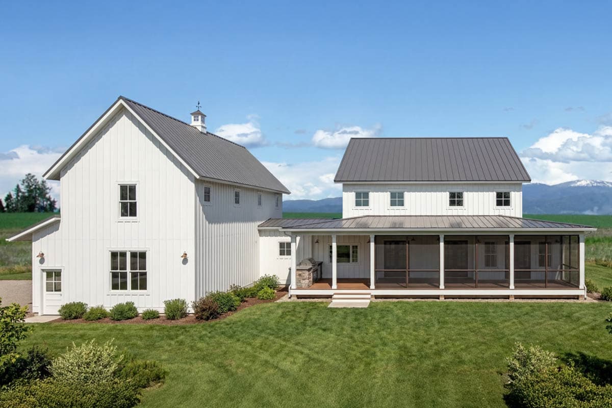Modern farmhouse exterior with white board-and-batten siding, metal roof, and screened-in porch.