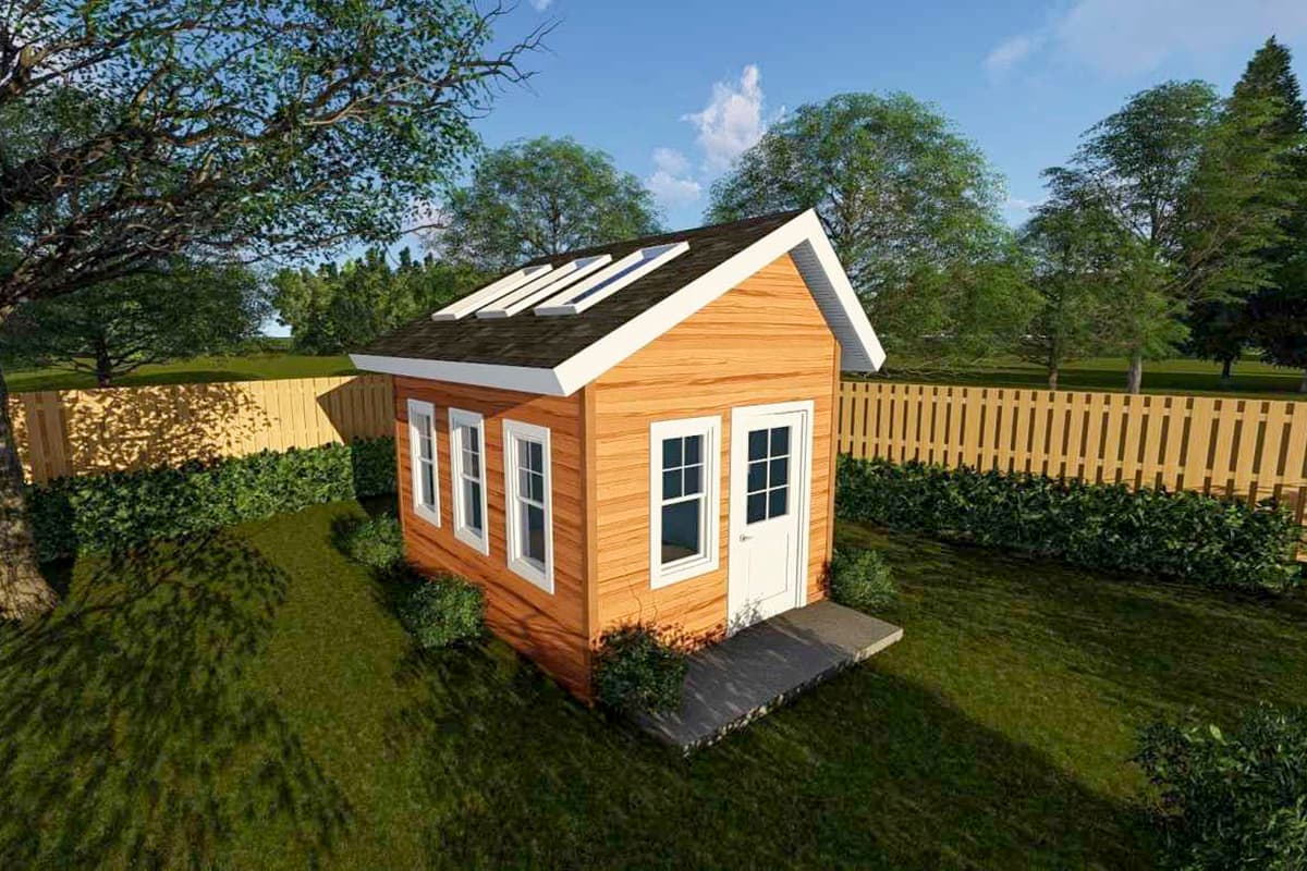 Small wooden shed exterior with wood siding, gable roof, skylights, door, and three windows.