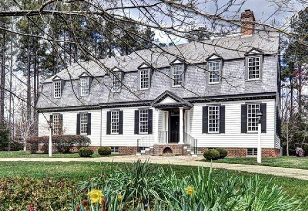 House plan exterior: Georgian style, two stories, dormer windows, symmetrical facade, central portico with columns.