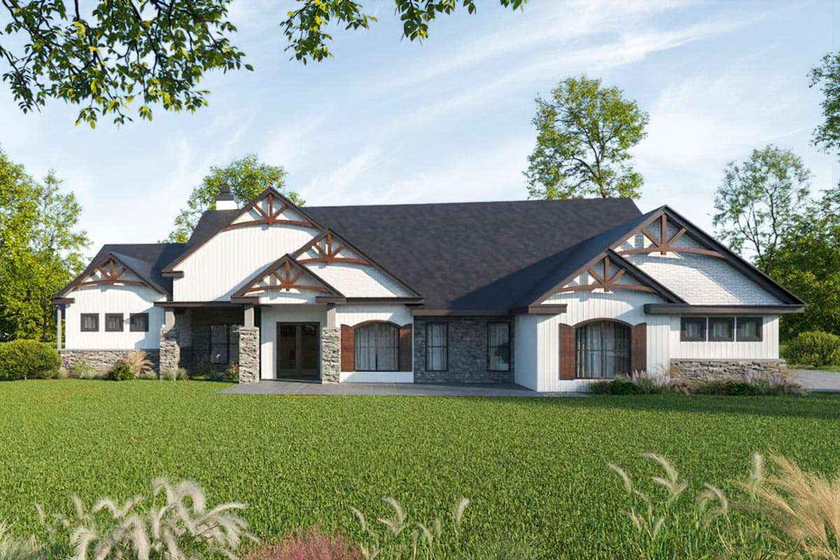 House plan exterior: Ranch style with stone accents, prominent gables with decorative timber framing, and a covered entryway.
