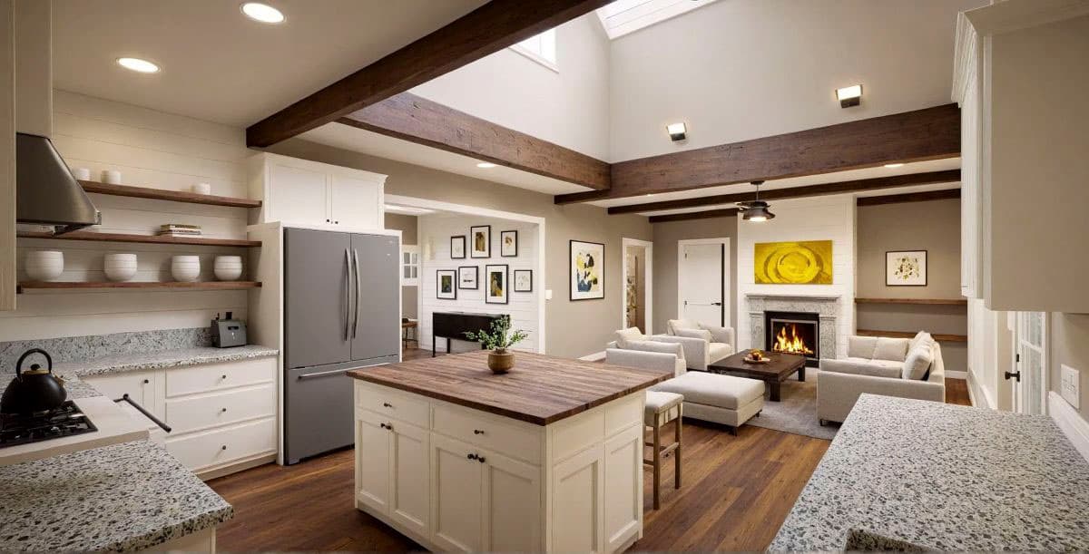 Open concept kitchen and great room with vaulted ceiling, exposed beams, fireplace, and island.