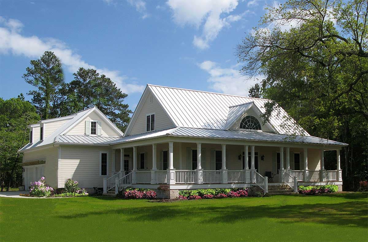 House plan exterior of a two-story Modern Farmhouse with a wraparound porch, metal roof, and gabled dormers.
