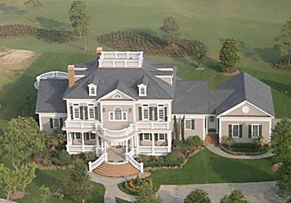 House plan exterior, Southern Colonial style, multi-story, with rounded porch, dormers, and multiple gables.