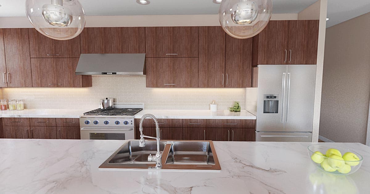Modern kitchen with dark wood cabinetry, stainless steel appliances including a range and refrigerator, and a large island with a double sink.