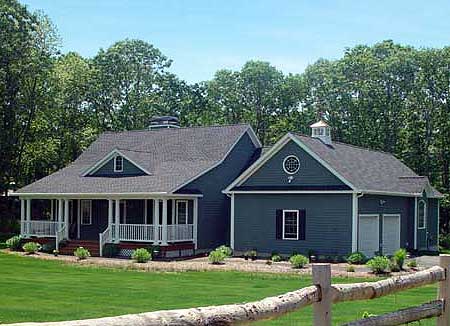 House plan exterior: One-story home with wraparound porch, gables, dormer, and attached garage with cupola.