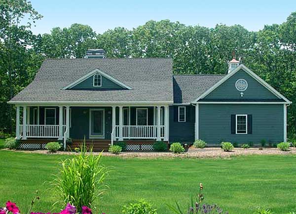 House plan exterior, one story, with wraparound porch, dormer, and circular gable window.