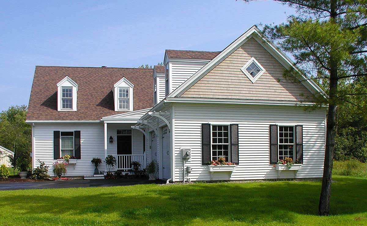 House plan exterior with dormers, gabled dormer, shingled gable, and front porch.