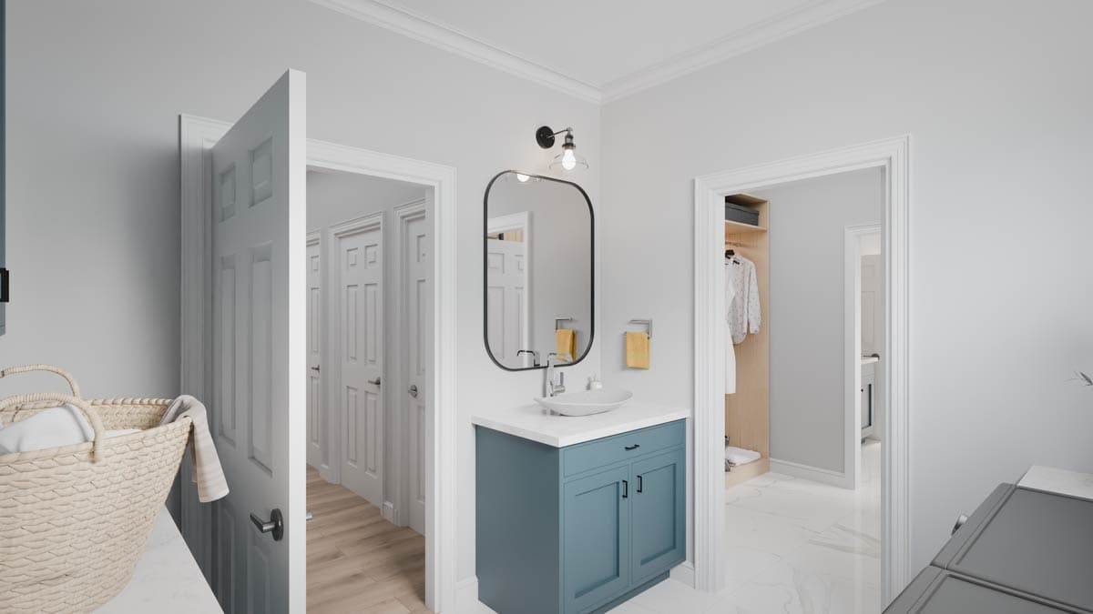 Bathroom interior with vanity, sink, mirror, open closet, and laundry area with washer and dryer.