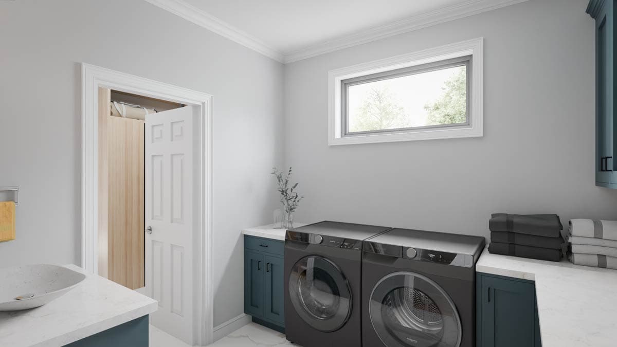 Laundry room with stacked washer and dryer, white quartz countertop, navy cabinets, and a small window.