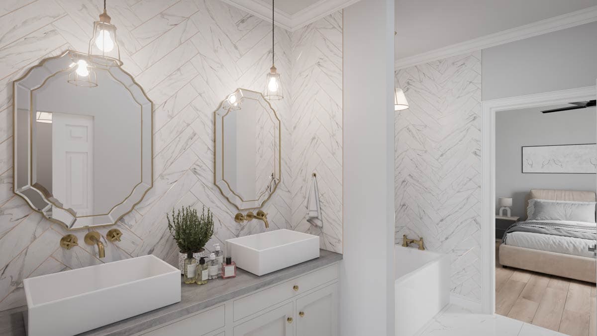 Bathroom with herringbone marble tile, double vanity with vessel sinks, and a freestanding tub. Adjacent bedroom visible.